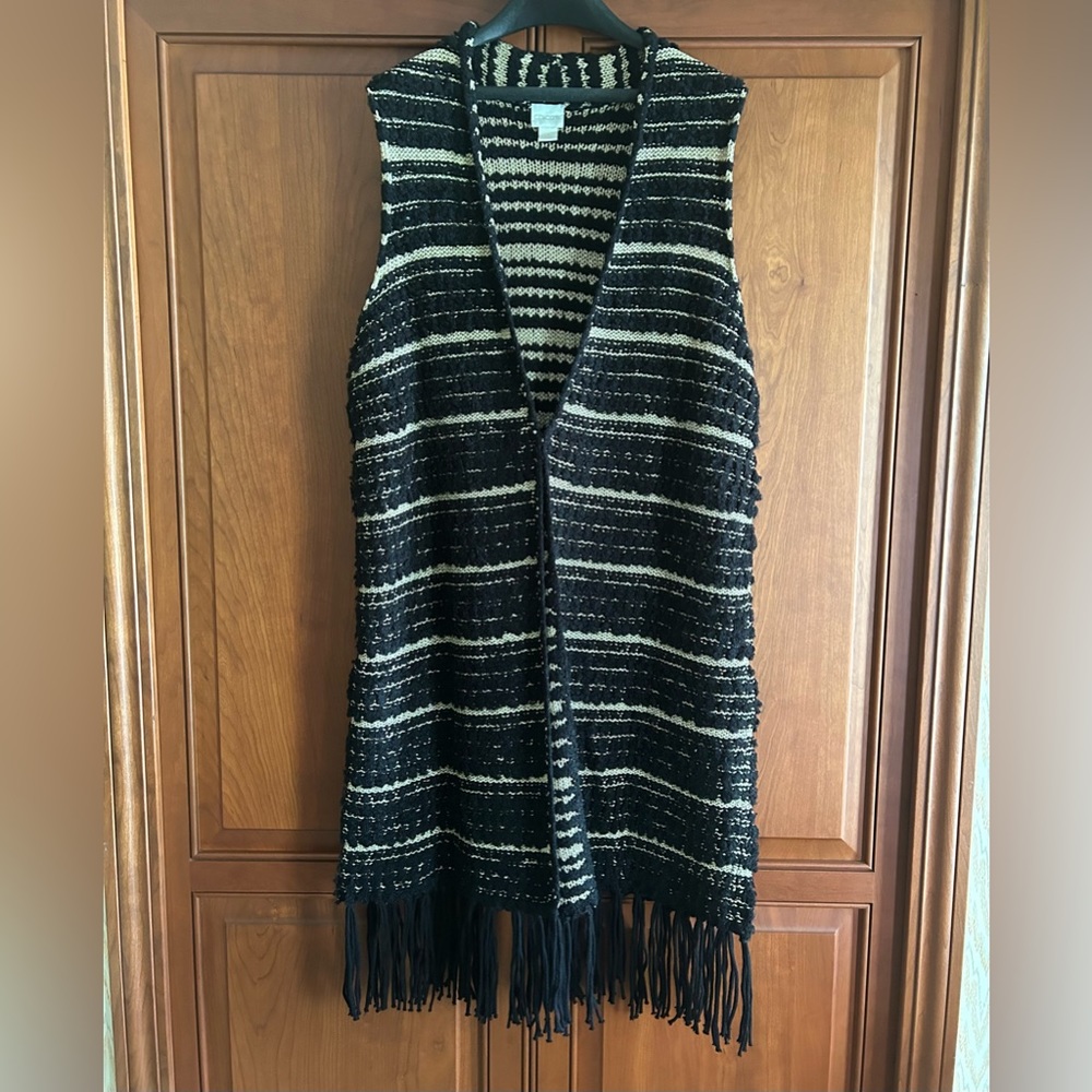 Beautiful duster vest. Easy to style and easy to care for.